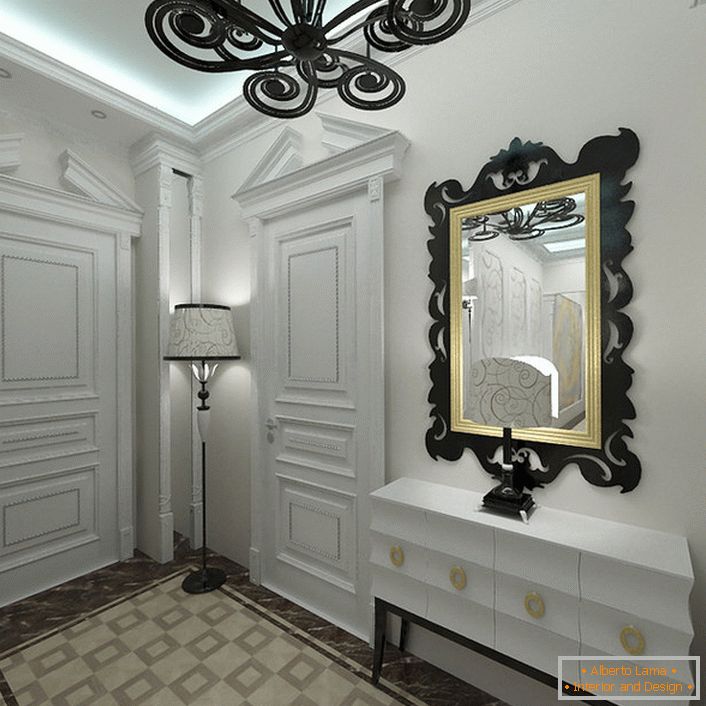 V slogu Art deco so v notranjosti všeč svetlobe. Vhod, v beli barvi, je opazen za pravilno izbrane kontrastne dekorativne elemente.