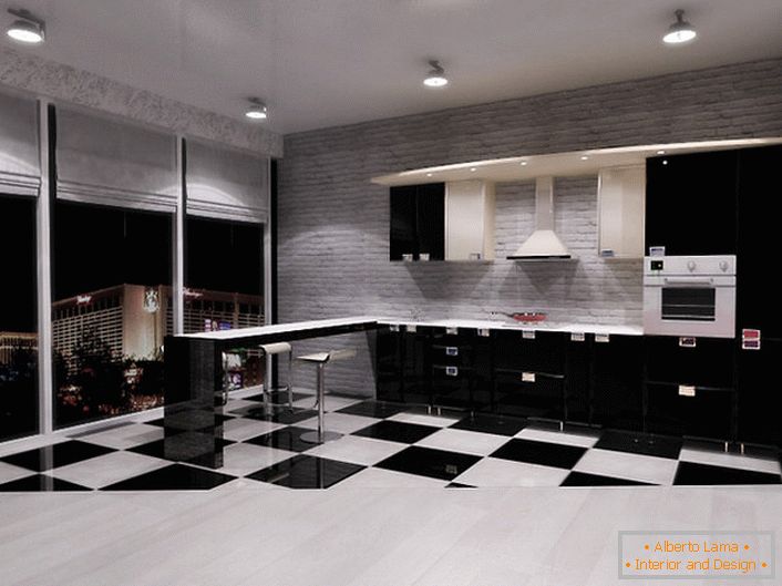 Kuhinja v slogu minimalizma v studio apartmaju s panoramskimi okni je odlična izbira za ljudi, ki imajo radi prostor in svobodo delovanja.