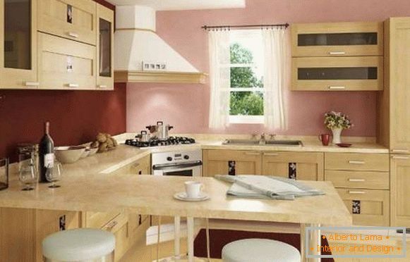Notranjost vogalne kuhinje z barskim pultom - fotografija v bež in roza toni