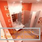 Oblikovanje ozke kopalnice v oranžnih tonih