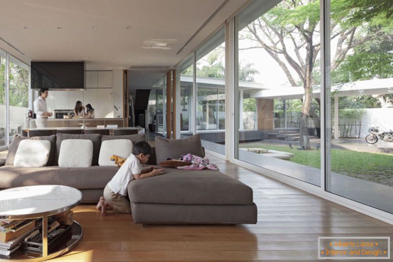 elegant-comfort-modern-home-indoor-glass-balkon-with-cream-sofas-on-the-wooden-floor-it-also-has-cool-glasses-windows-with-round-coffee-table