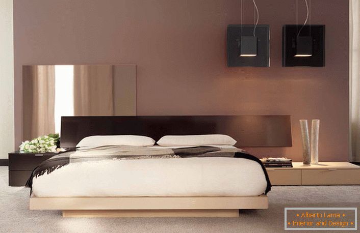 Minimalističen dizajn z notami japonske barve v spalnici običajnega francoskega stanovanja. 