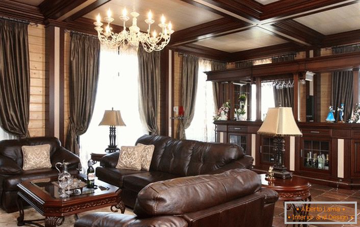 Elegantna soba z barskim pultom. Pozornost privlači ogromno oblazinjeno pohištvo, odtenek. 