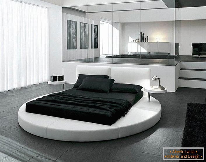 Zasnova spalnice v slogu minimalizma je poudarjena z ustrezno izbranim pohištvom. Zanimiva notranjost je okrogla postelja.